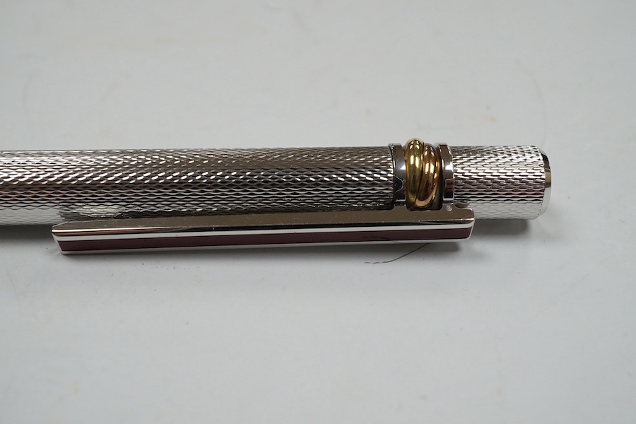 A Cartier pen, 14cm long, boxed. Condition - good